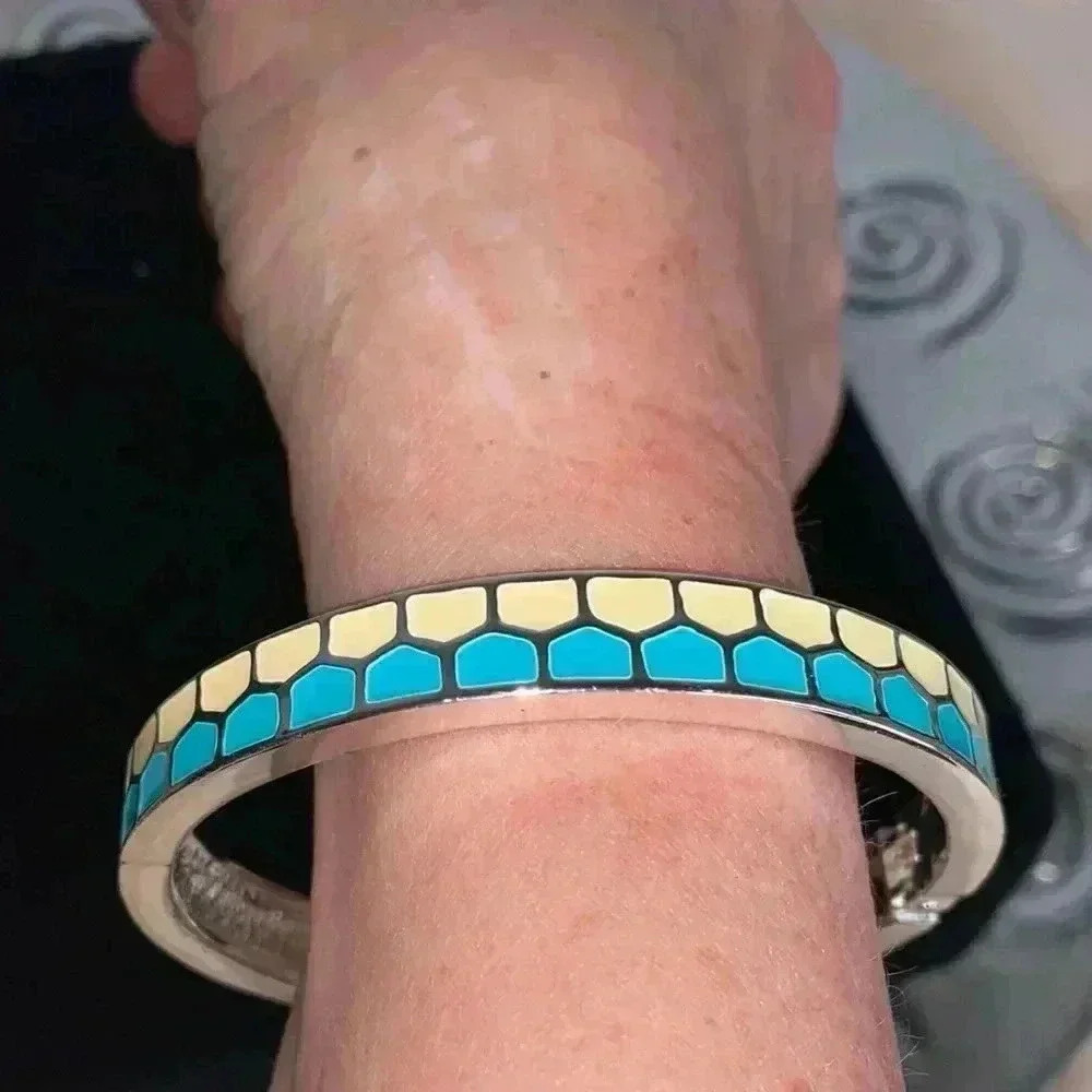 Turquoise and cream colored hinged bracelet